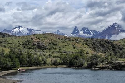 Scenic view of lake and mountains against sky