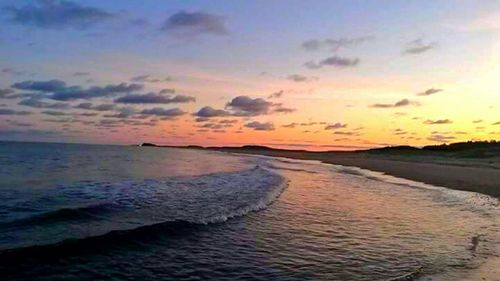 Scenic view of sea at sunset