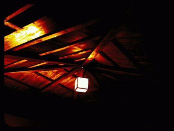 Low angle view of illuminated lights at night
