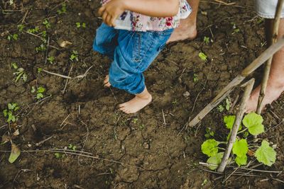 Low section of woman standing on ground