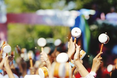 People playing musical instruments during sunny day