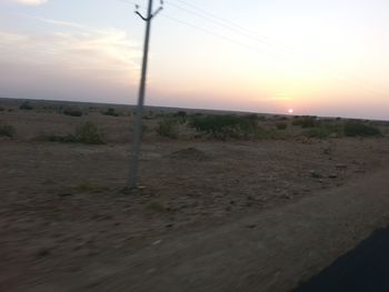 Scenic view of landscape against sky during sunset