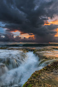 Scenic view of sea against sky during sunset