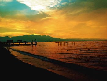 Scenic view of sea at sunset