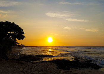 Scenic view of sea against sky at sunset
