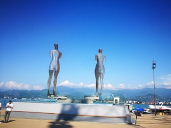 Panoramic view of sea against clear blue sky