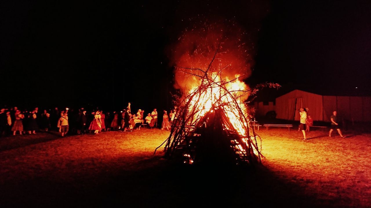 PEOPLE AT ILLUMINATED NIGHT