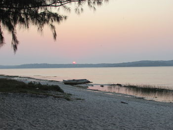 Scenic view of calm sea at sunset