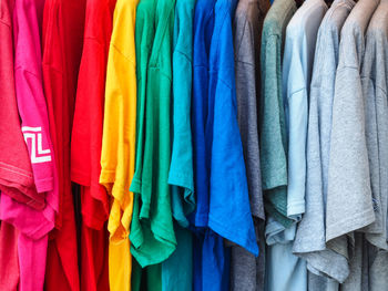 Full frame shot of multi colored clothes hanging at store