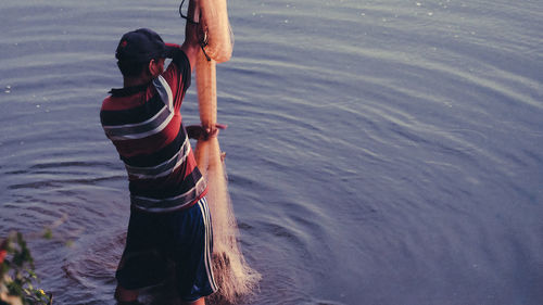 High angle view of man working in water