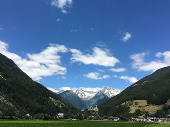 Scenic view of landscape and mountains against sky