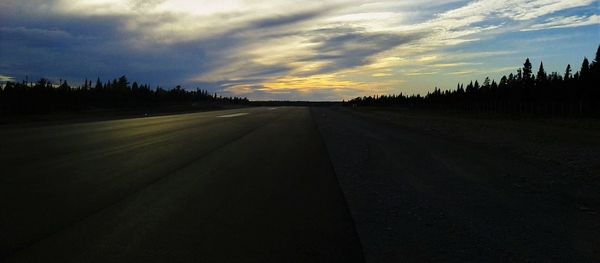 Road against sky at sunset