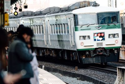 Man and woman at railroad station