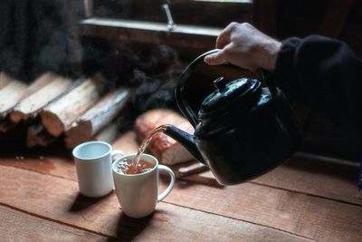 Close-up of coffee pouring in glass