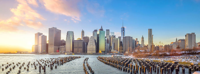 Panoramic view of buildings against sky during sunset