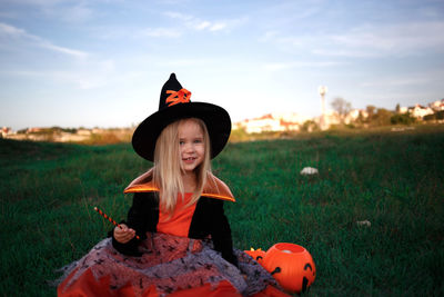 Portrait of smiling girl on field