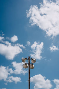 Low angle view of street light against sky