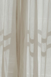Full frame shot of sunlit curtain