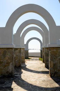 Archway of historic building against clear sky