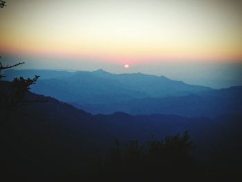 Scenic view of mountains at sunset