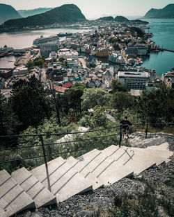 High angle view of townscape by sea