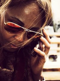 Close-up of woman talking on mobile phone