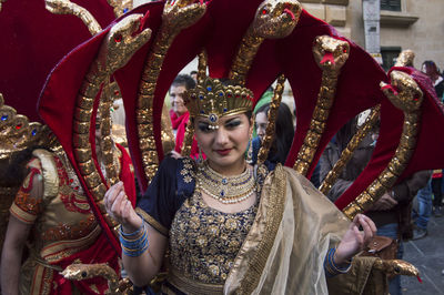 Portrait of woman in snake costume during carnival