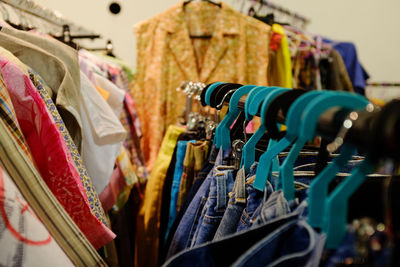 Clothes hanging in rack at store