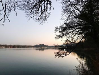 Reflection of trees in lake against sky