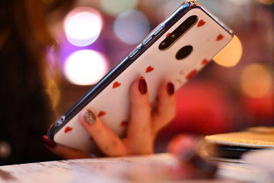 Close-up of woman using mobile phone