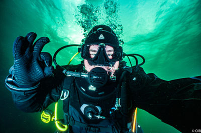 Portrait of man swimming in sea