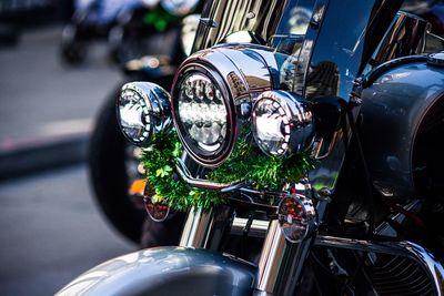 Close-up of motorcycle in city