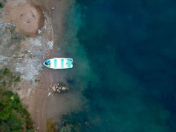 Aerial view of boat on shore at beach