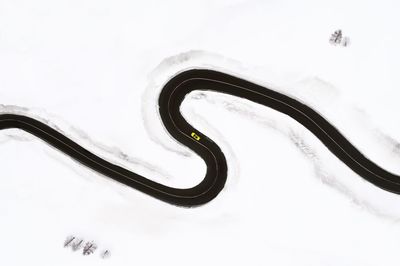 High angle view of road amidst snow during winter