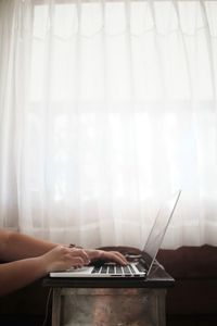Man using mobile phone at home