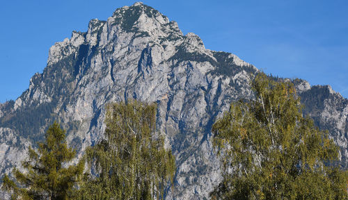 Low angle view of rock formation against sky