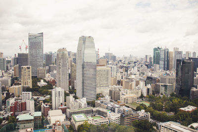 High angle view of buildings in city against sky