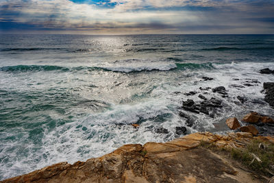 Scenic view of sea against sky during sunset