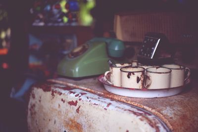 Close-up of coffee cups on table