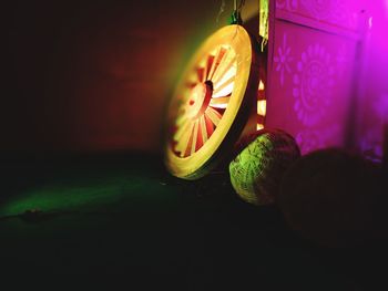 Close-up of illuminated lights on table