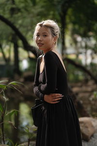 Low angle view of woman looking away