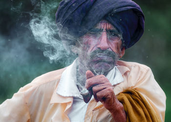 Tribal man smoking  pipe