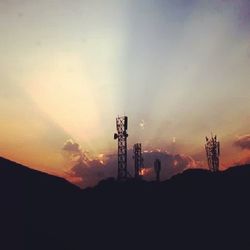 Silhouette of power lines at sunset