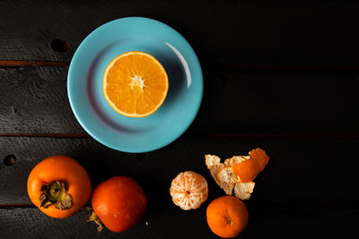 High angle view of orange fruit on table