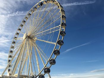 Low angle view of ferris wheel against sky