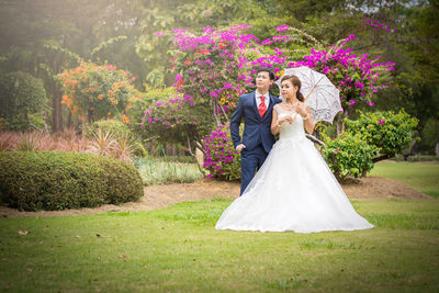 Couple holding flower bouquet