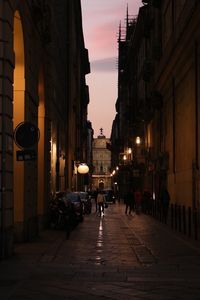 People in city at sunset