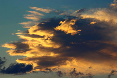 Low angle view of dramatic sky during sunset