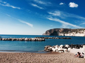 Scenic view of sea against blue sky