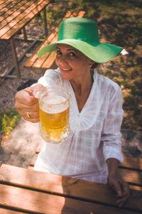 Midsection of a woman drinking glass